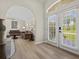 Bright foyer features a seamless transition to a spacious living area with stylish tile flooring at 23 Pine Valley Ct, Rotonda West, FL 33947