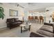 Cozy living room featuring comfortable seating and an open floor plan to kitchen at 23 Pine Valley Ct, Rotonda West, FL 33947