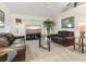 Spacious living room with plenty of natural light and a modern coastal aesthetic at 23 Pine Valley Ct, Rotonda West, FL 33947