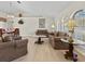 Open-concept living and dining areas showcasing neutral paint, ample seating, and plentiful natural light at 23 Pine Valley Ct, Rotonda West, FL 33947