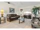 Bright and airy living room featuring comfortable seating and modern decor at 23 Pine Valley Ct, Rotonda West, FL 33947