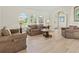 Comfortable living space with recessed lighting, large windows, and stylish tile flooring at 23 Pine Valley Ct, Rotonda West, FL 33947