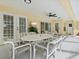 Covered patio offers a dining area and lounge seating, ideal for outdoor enjoyment at 23 Pine Valley Ct, Rotonda West, FL 33947