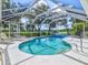 Inviting screened-in pool area with clear blue water and ample space for lounging and enjoying outdoor living at 23 Pine Valley Ct, Rotonda West, FL 33947