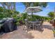 Relax with friends and Gathering on this brick paved back patio, complete with a grill and seating area at 237 Park Forest Blvd, Englewood, FL 34223