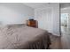 The bedroom has a clean and simple design with a wood floor, a large closet, and a neutral color palette at 237 Park Forest Blvd, Englewood, FL 34223
