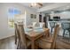Cozy dining area with a view to the kitchen, creating an ideal space for Gathering meals at 237 Park Forest Blvd, Englewood, FL 34223