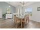 Bright dining room featuring a large window, stylish decor, and wood-look floors at 237 Park Forest Blvd, Englewood, FL 34223