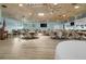Spacious event room with tables, chairs, ceiling fans, and a vaulted wood ceiling at 237 Park Forest Blvd, Englewood, FL 34223