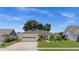 Charming single-story home with a two-car garage, well-maintained lawn, and mature landscaping at 237 Park Forest Blvd, Englewood, FL 34223