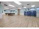 Spacious game room with pool tables, ping pong tables, and large windows offering natural light at 237 Park Forest Blvd, Englewood, FL 34223