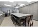 Spacious kitchen features a large island, stainless steel appliances, and ample storage at 237 Park Forest Blvd, Englewood, FL 34223