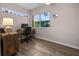 Office space featuring wood floors, desk with computer and a large window at 237 Park Forest Blvd, Englewood, FL 34223