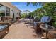 The brick patio features comfortable wicker seating and lounge chairs for relaxing in the sun at 237 Park Forest Blvd, Englewood, FL 34223