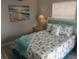 Comfortable bedroom with a calming coastal decor and bright natural light at 2373 N Beach Rd # 1C, Englewood, FL 34223