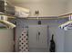 Organized closet featuring storage shelving, cabinet, and clothing hangers at 2373 N Beach Rd # 1C, Englewood, FL 34223