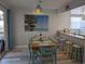 Cozy dining area featuring a unique lighting fixture and casual bar seating at 2373 N Beach Rd # 1C, Englewood, FL 34223