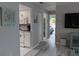Bright kitchen leading to relaxing living room and hallway at 2373 N Beach Rd # 1C, Englewood, FL 34223