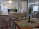 Modern kitchen with stainless steel appliances adjacent to the dining and living area at 2373 N Beach Rd # 1C, Englewood, FL 34223