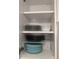 Organized kitchen cabinet with plates, bowls, and dinnerware neatly arranged at 2373 N Beach Rd # 1C, Englewood, FL 34223