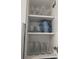 Neatly organized kitchen cabinet with glasses and mugs on shelves at 2373 N Beach Rd # 1C, Englewood, FL 34223