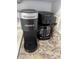 Kitchen counter featuring a Keurig coffee maker and Proctor Silex coffee maker at 2373 N Beach Rd # 1C, Englewood, FL 34223