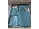 Organized kitchen drawer with neatly folded towels and oven mitt at 2373 N Beach Rd # 1C, Englewood, FL 34223