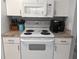 Close up of modern appliances and counter in a well-equipped kitchen at 2373 N Beach Rd # 1C, Englewood, FL 34223