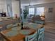 Open-concept living area blending dining and kitchen space in a modern design at 2373 N Beach Rd # 1C, Englewood, FL 34223