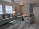 Bright living room with cozy seating, soft lighting, and stylish decor at 2373 N Beach Rd # 1C, Englewood, FL 34223