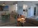 Cozy living room featuring dining area, kitchen, and comfortable seating arrangements at 2373 N Beach Rd # 1C, Englewood, FL 34223
