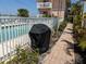 Outdoor grill covered for weather protection by the community pool at 2373 N Beach Rd # 1C, Englewood, FL 34223