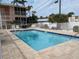 Inviting community pool surrounded by lush landscaping and serene atmosphere at 2373 N Beach Rd # 1C, Englewood, FL 34223