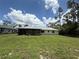Spacious backyard with lush green grass, perfect for outdoor activities and relaxation at 2473 Woodyglen St, Port Charlotte, FL 33948