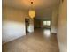 Open dining room with tile flooring and a chandelier at 2473 Woodyglen St, Port Charlotte, FL 33948