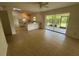 Open concept living room with a ceiling fan at 2473 Woodyglen St, Port Charlotte, FL 33948