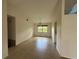 Bright living room with tile flooring and a window offering plenty of natural light at 2473 Woodyglen St, Port Charlotte, FL 33948