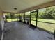 Enclosed patio with screen, providing an enjoyable outdoor living space at 2473 Woodyglen St, Port Charlotte, FL 33948