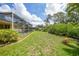 Expansive backyard with greenery, pool, and gazebo at 2588 Westberry Ter, North Port, FL 34286