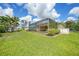 Beautiful backyard with screened-in pool, shed, and well-kept lawn at 2588 Westberry Ter, North Port, FL 34286