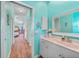 Bathroom adjacent to bedroom, features a white vanity and tile floors at 2588 Westberry Ter, North Port, FL 34286