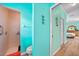 Hall bathroom features a tiled shower, toilet and convenient towel bar at 2588 Westberry Ter, North Port, FL 34286