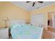 Bedroom featuring neutral carpet, starfish themed bedding, and a double door closet at 2588 Westberry Ter, North Port, FL 34286