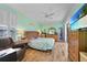 Tranquil bedroom with a ceiling fan, coastal decor and sliding glass doors at 2588 Westberry Ter, North Port, FL 34286