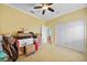 Bedroom with closet and ceiling fan; ideal for organizing and personalizing your own space at 2588 Westberry Ter, North Port, FL 34286