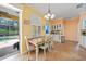 Cozy dining area featuring natural light and direct access to the outdoor pool at 2588 Westberry Ter, North Port, FL 34286
