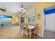 Bright dining area next to living area with sliding doors leading to lanai at 2588 Westberry Ter, North Port, FL 34286