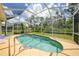 The screened-in pool offers a refreshing escape and a sunny spot to unwind and enjoy the outdoors at 2588 Westberry Ter, North Port, FL 34286