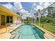 Inviting screened-in pool area, perfect for relaxing and entertaining outdoors at 2588 Westberry Ter, North Port, FL 34286