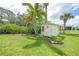 Well-maintained shed in lush green backyard offering extra storage at 2588 Westberry Ter, North Port, FL 34286
